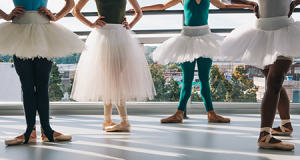 Ballerinas demonstrating first through fifth positions